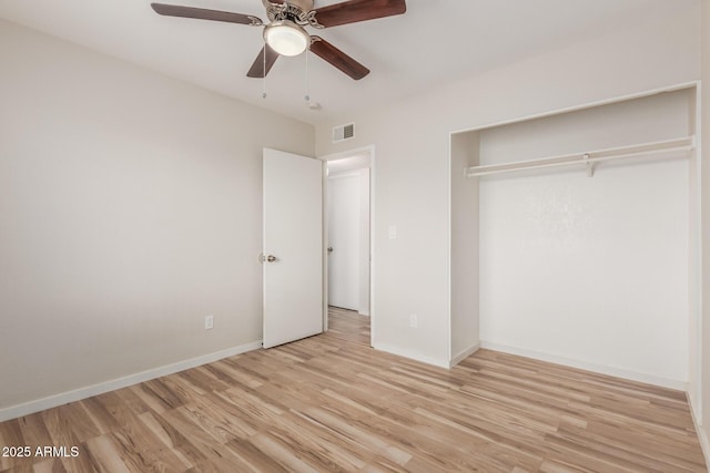 unfurnished bedroom with visible vents, ceiling fan, light wood-type flooring, and baseboards