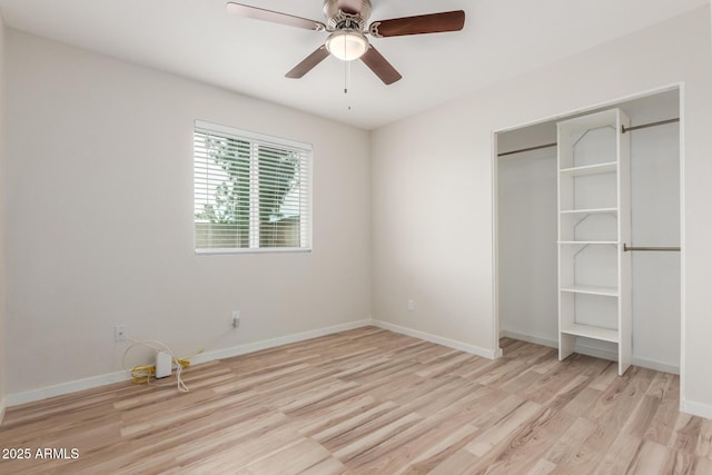 unfurnished bedroom with light wood-type flooring, baseboards, and ceiling fan