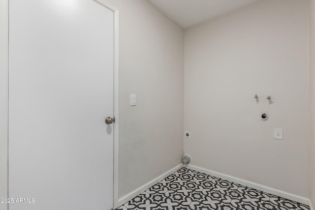 laundry area with laundry area, hookup for an electric dryer, gas dryer hookup, and baseboards