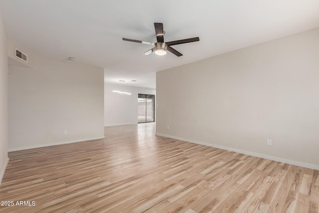 empty room with light wood-type flooring, visible vents, baseboards, and ceiling fan