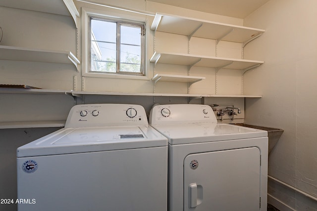 washroom with independent washer and dryer