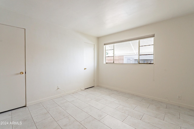 view of tiled spare room