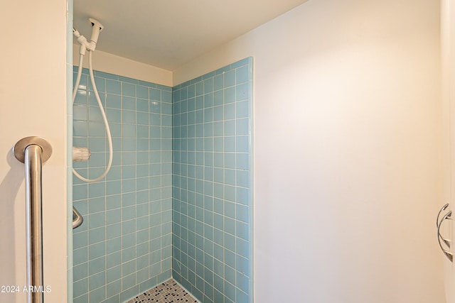 bathroom with tiled shower