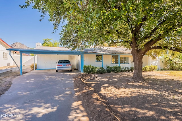 ranch-style house with a carport