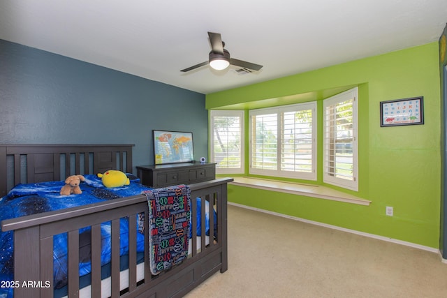 bedroom featuring carpet, visible vents, a ceiling fan, and baseboards