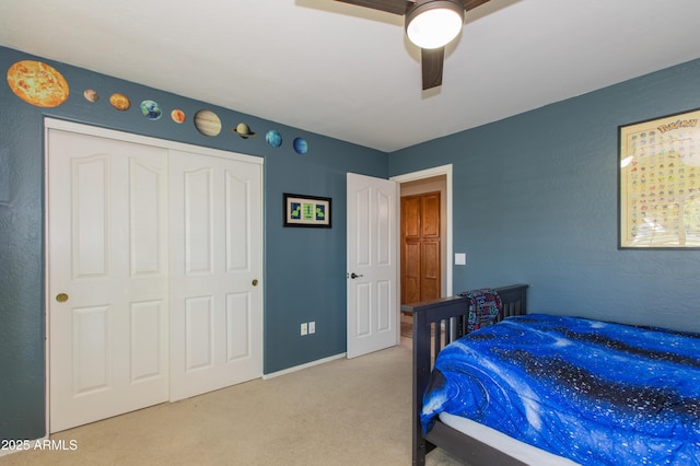 bedroom featuring ceiling fan, carpet flooring, and a closet
