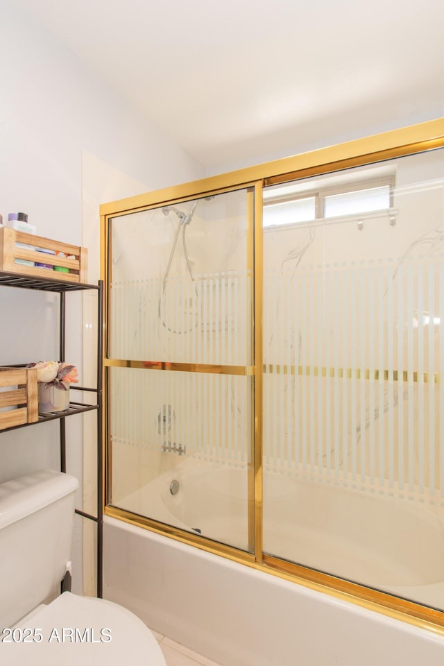 full bath with toilet and combined bath / shower with glass door