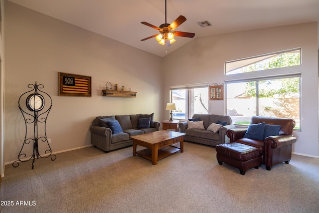 living room featuring high vaulted ceiling, light carpet, and ceiling fan