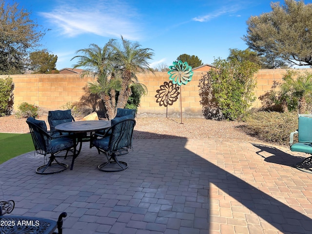 view of patio / terrace with outdoor dining space and a fenced backyard