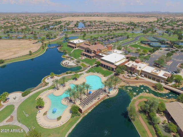 drone / aerial view with a water view and a residential view