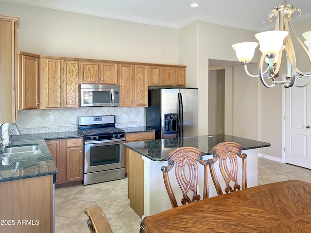 kitchen featuring a notable chandelier, crown molding, appliances with stainless steel finishes, light tile patterned flooring, and a sink