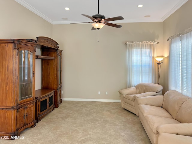 living area featuring baseboards, ceiling fan, recessed lighting, and crown molding