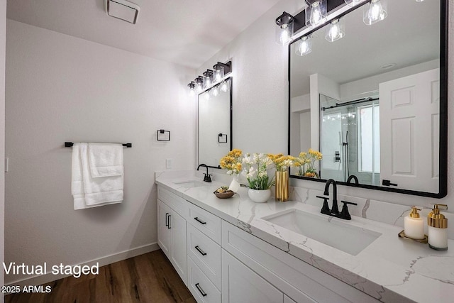 619 N Norfolk, Mesa, AZ 85205 - bathroom with a shower stall, baseboards, double vanity, and wood finished floors