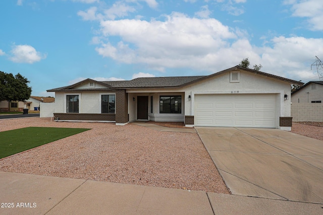 619 N Norfolk, Mesa, AZ 85205 - ranch-style home with brick siding, driveway, a garage, and stucco siding