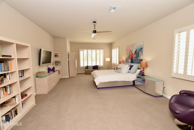 9842 E Celtic Dr, Scottsdale, AZ 85260 - bedroom featuring light colored carpet, baseboards, and a ceiling fan