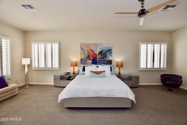 9842 E Celtic Dr, Scottsdale, AZ 85260 - carpeted bedroom with baseboards, multiple windows, and ceiling fan