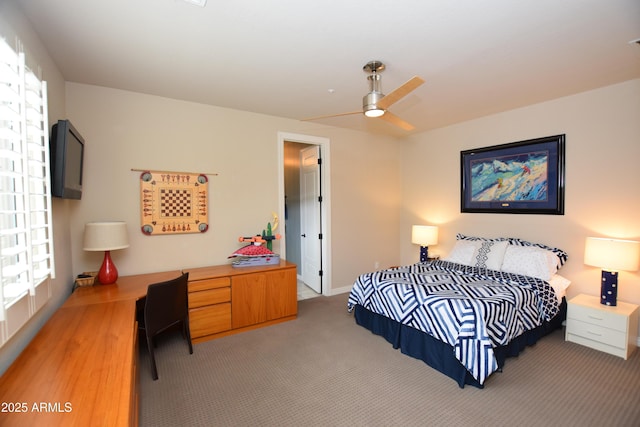 9842 E Celtic Dr, Scottsdale, AZ 85260 - bedroom featuring light carpet, baseboards, and ceiling fan