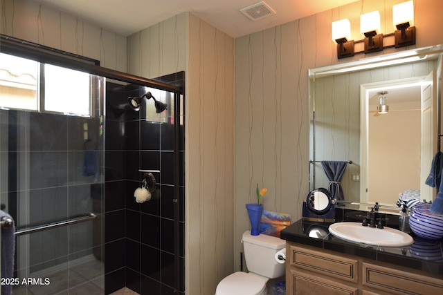 9842 E Celtic Dr, Scottsdale, AZ 85260 - bathroom featuring a shower stall, toilet, and vanity