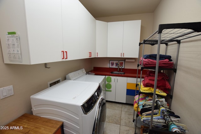 9842 E Celtic Dr, Scottsdale, AZ 85260 - laundry room featuring cabinet space, independent washer and dryer, and light tile patterned flooring