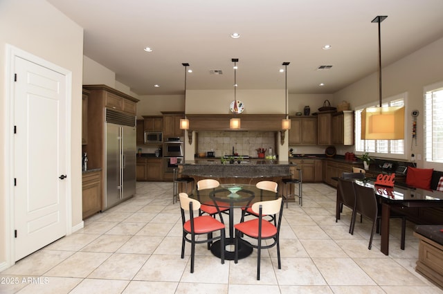 9842 E Celtic Dr, Scottsdale, AZ 85260 - dining room with light tile patterned floors and recessed lighting
