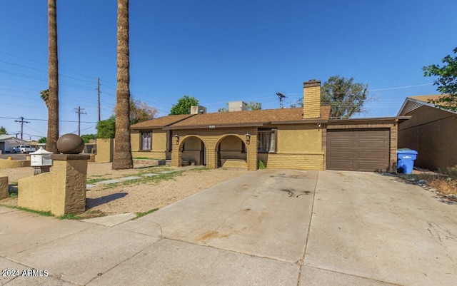 5850 W Cheery Lynn Rd, Phoenix, AZ 85031 - single story home featuring a chimney, a garage, and driveway