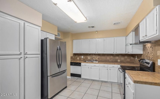 5850 W Cheery Lynn Rd, Phoenix, AZ 85031 - kitchen featuring a textured ceiling, white cabinetry, visible vents, appliances with stainless steel finishes, and a sink