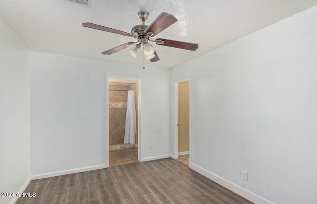 unfurnished room featuring dark hardwood / wood-style floors and ceiling fan