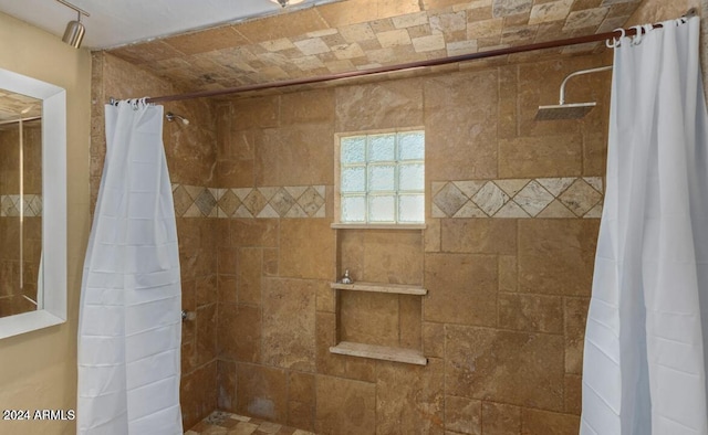 bathroom with a shower with curtain