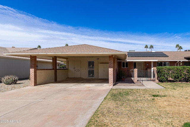 single story home with a carport, a porch, and a front lawn