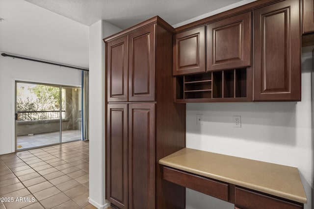 19700 N 76th St Unit 1103, Scottsdale, AZ 85255 - kitchen with open shelves, light tile patterned floors, dark brown cabinets, and light countertops