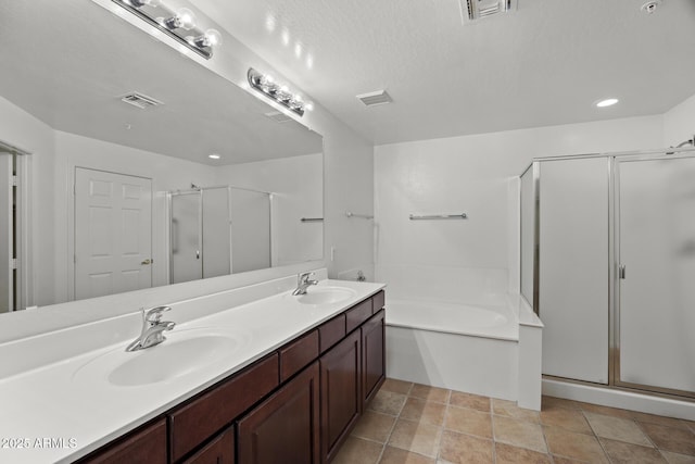 19700 N 76th St Unit 1103, Scottsdale, AZ 85255 - bathroom featuring a shower stall, double vanity, a garden tub, and recessed lighting