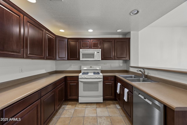 19700 N 76th St Unit 1103, Scottsdale, AZ 85255 - kitchen featuring white appliances, recessed lighting, a peninsula, dark brown cabinets, and light countertops