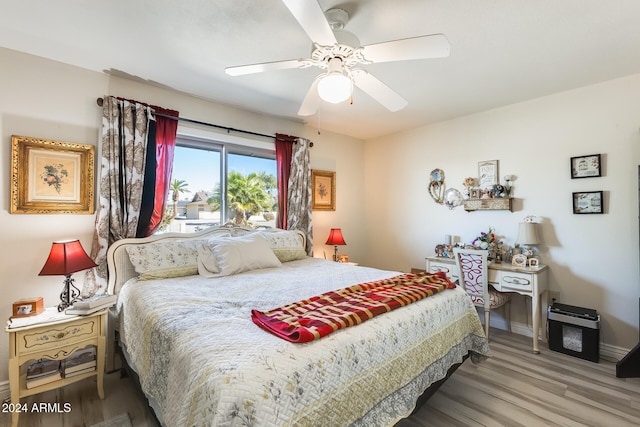 bedroom featuring wood-type flooring and ceiling fan