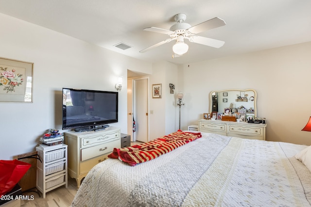 bedroom featuring light hardwood / wood-style floors and ceiling fan