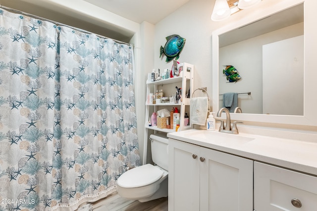 bathroom featuring vanity, hardwood / wood-style floors, a shower with shower curtain, and toilet