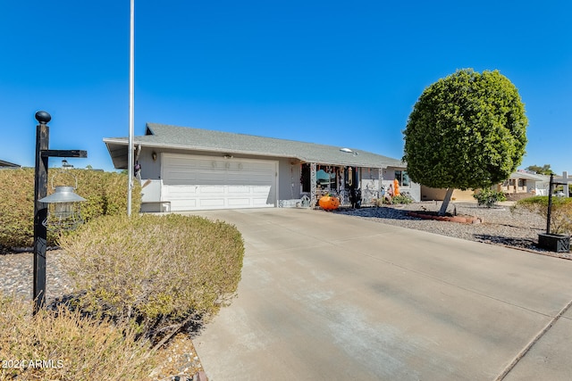 ranch-style home featuring a garage