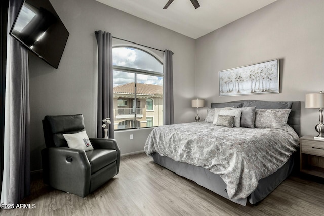 bedroom with wood finished floors and a ceiling fan