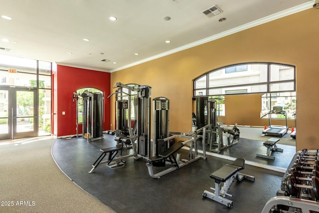 exercise room featuring recessed lighting, visible vents, and ornamental molding