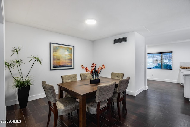 dining room with dark hardwood / wood-style floors