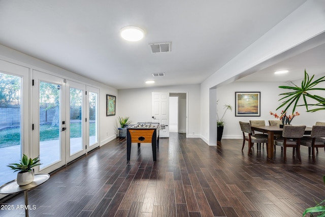 playroom featuring dark wood-type flooring