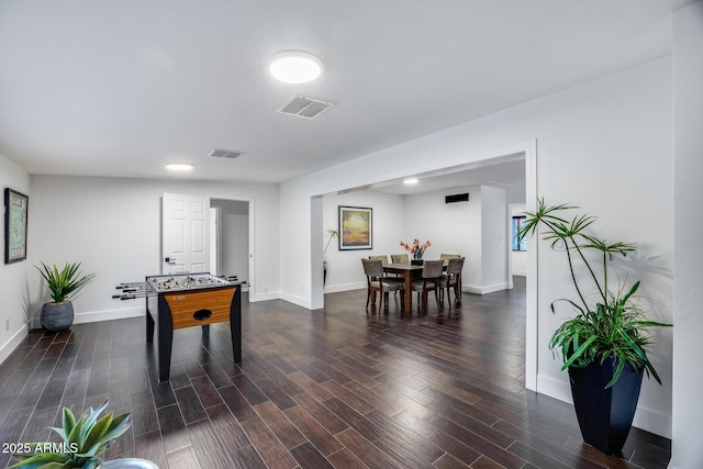 rec room with dark wood-type flooring