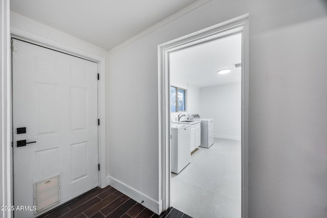 clothes washing area featuring washer and dryer