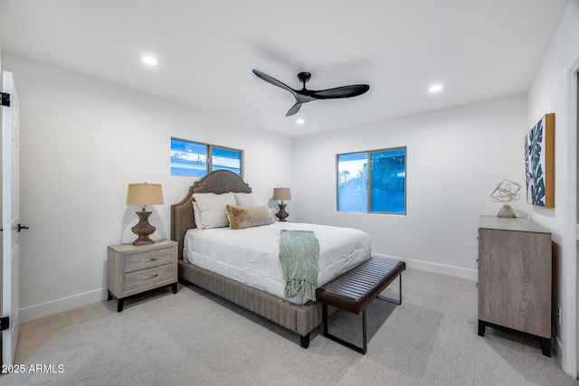 bedroom featuring ceiling fan and light colored carpet