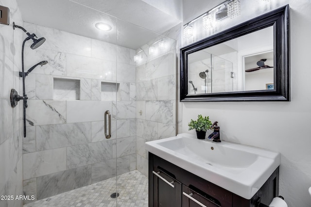 bathroom with vanity and a shower with shower door