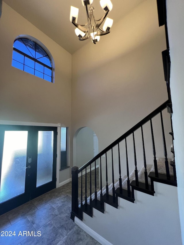 15230 N Blackbird Dr, Fountain Hills, AZ 85268 - entrance foyer with a chandelier, french doors, stairs, arched walkways, and baseboards