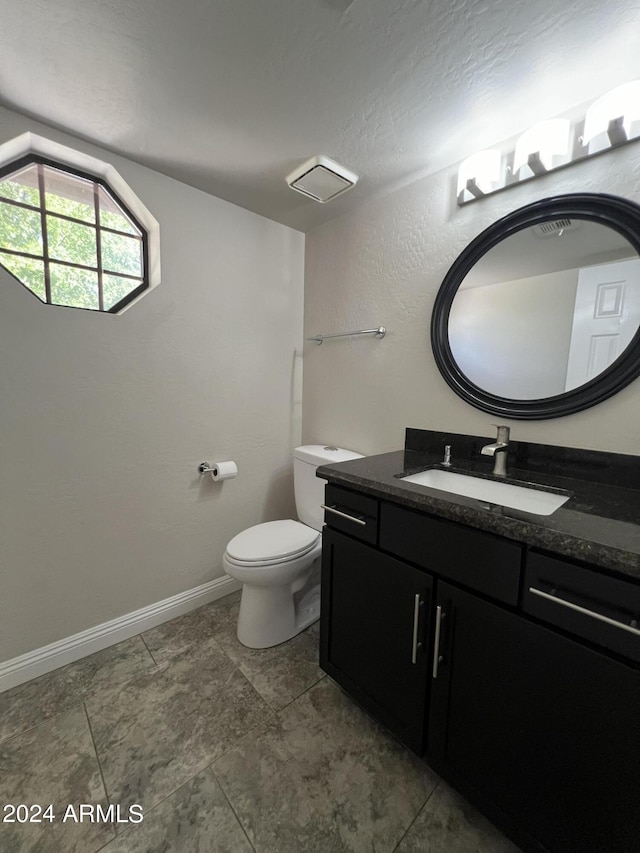 15230 N Blackbird Dr, Fountain Hills, AZ 85268 - bathroom featuring vanity, toilet, and baseboards