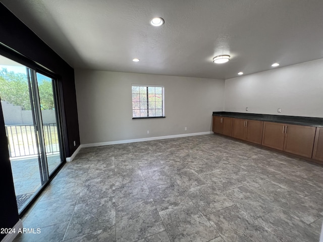 15230 N Blackbird Dr, Fountain Hills, AZ 85268 - empty room featuring baseboards, recessed lighting, and stone finish flooring