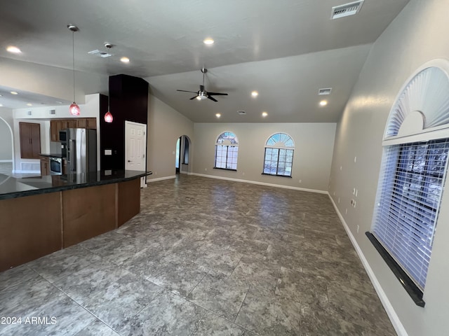 15230 N Blackbird Dr, Fountain Hills, AZ 85268 - unfurnished living room with vaulted ceiling, arched walkways, ceiling fan, baseboards, and recessed lighting