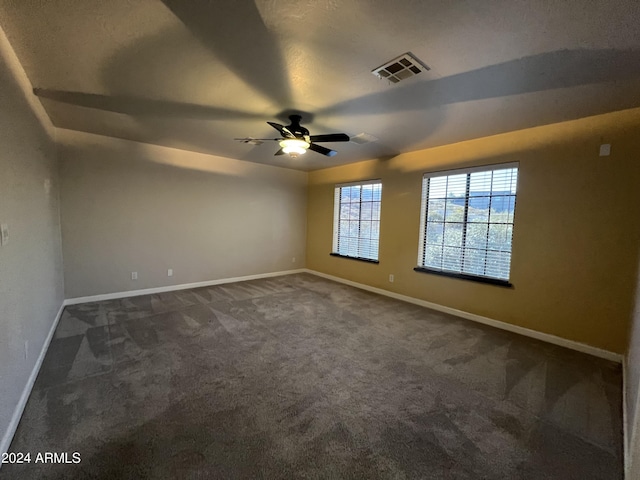 15230 N Blackbird Dr, Fountain Hills, AZ 85268 - spare room featuring dark carpet, baseboards, and ceiling fan