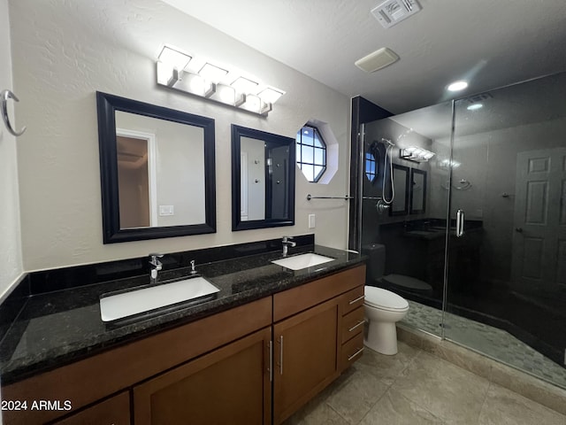 15230 N Blackbird Dr, Fountain Hills, AZ 85268 - bathroom featuring toilet, double vanity, a shower stall, and a textured wall